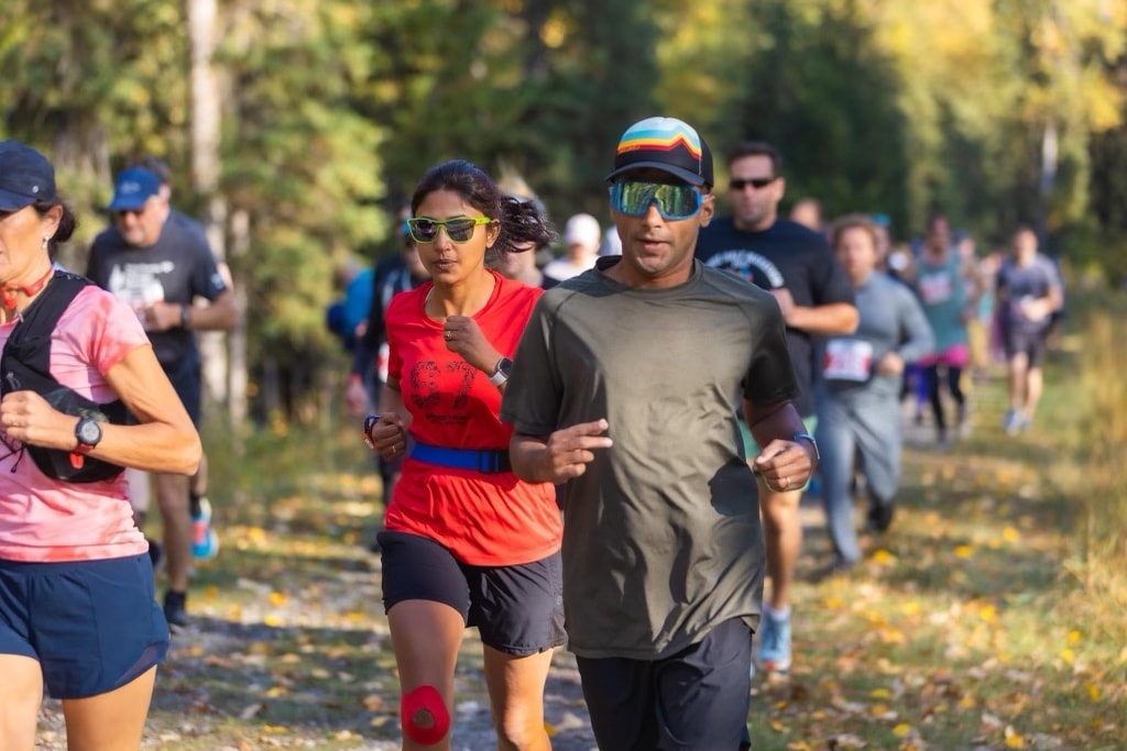 Harshan and Pru running a trail race in Fernie