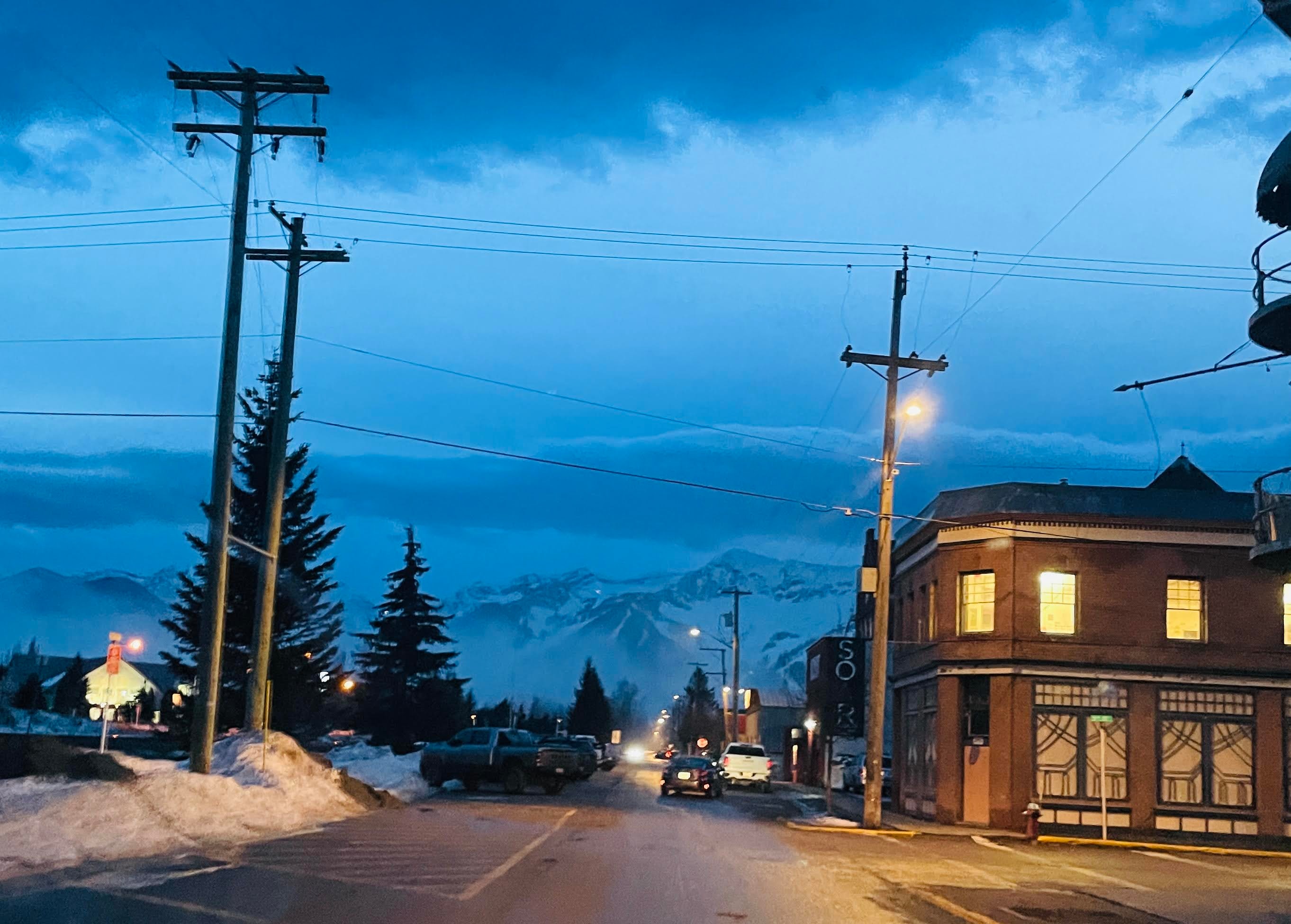 Fernie street at twilight with mountains in the background