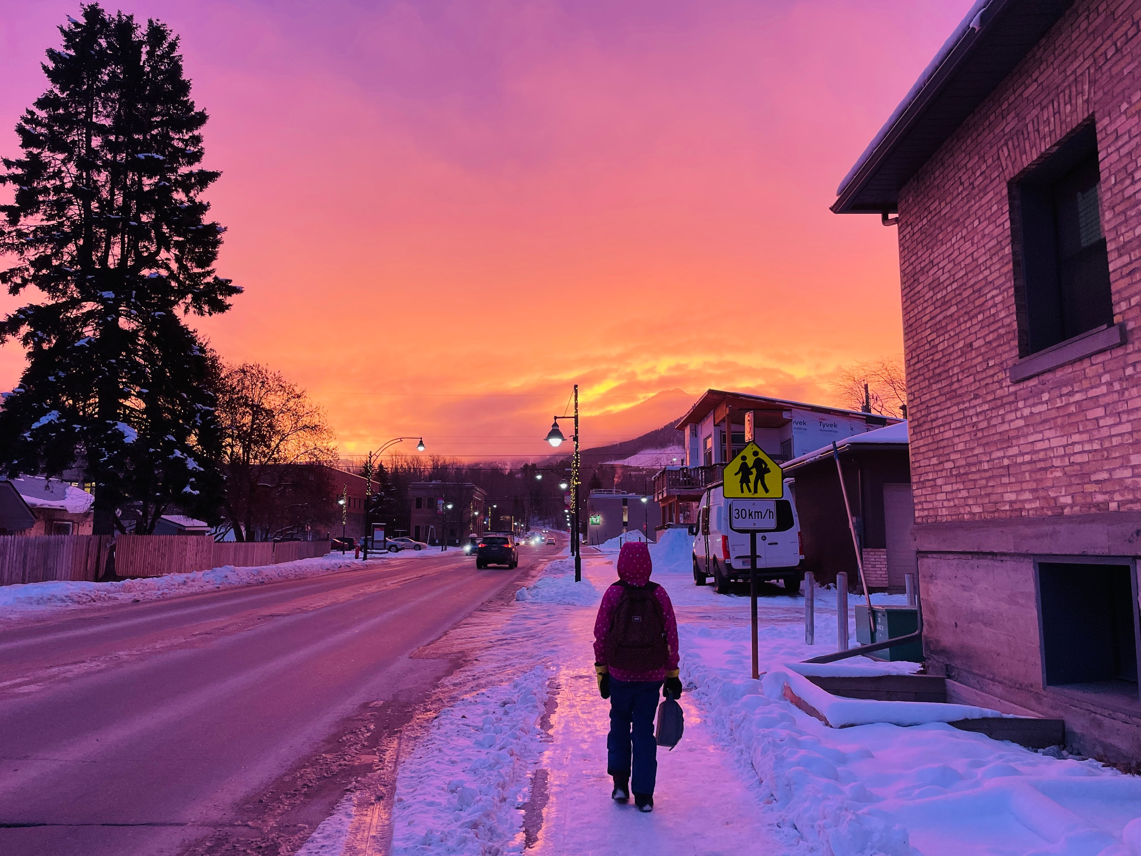 Child walking to school on a Fernie winter morning at sunrise