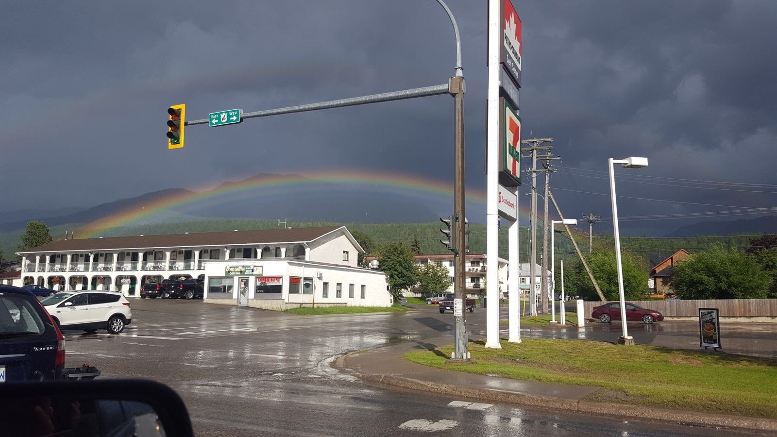 Fernie street scene with a double rainbow over the mountains